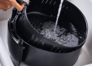 how do you remove sticky oil from a deep fryer