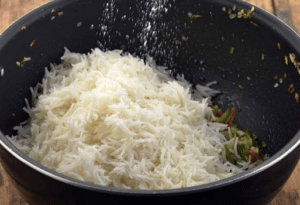 adding salt to rice