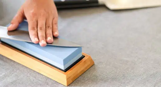 Using a whetstone to sharpen a knife 